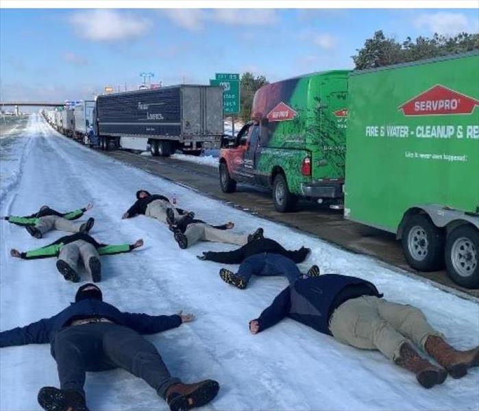 SERVPRO of Augusta team members make snow angels 