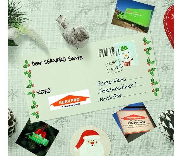 A letter to Santa with holiday ornaments