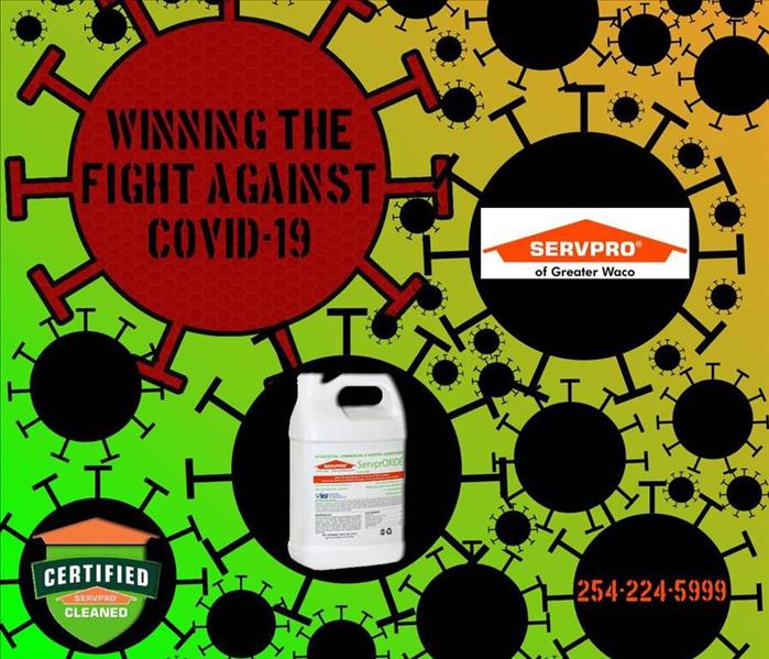 A drawing of Covid-19 molecules with the words "winning the fight against Covid-19" with the SERVPRO logo 