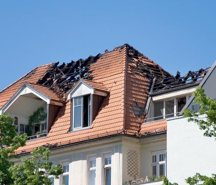 a home with fire damage to the roof